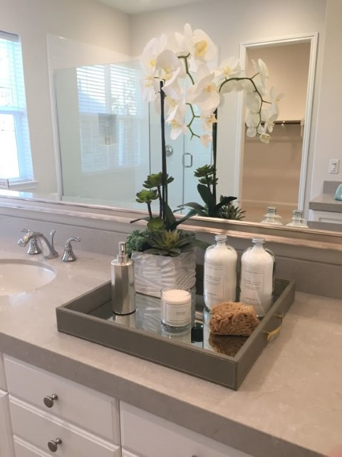 Accessories added to the Bathroom like flowers and aroma diffusers